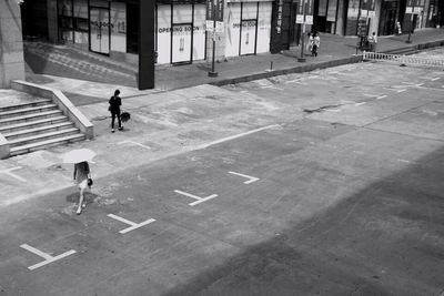 High angle view of man walking in city