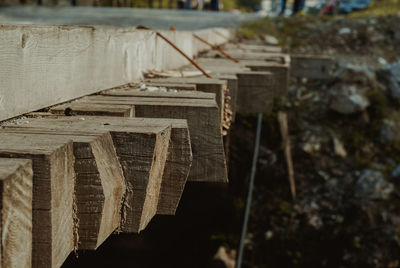 Close-up of old wooden structure on field