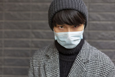 Portrait of young man wearing mask