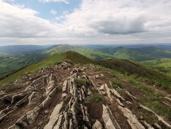 Scenic view of landscape against cloudy sky