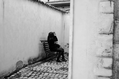 Rear view of woman walking on street