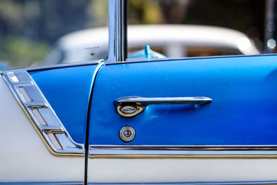 Close-up of car door during sunny day