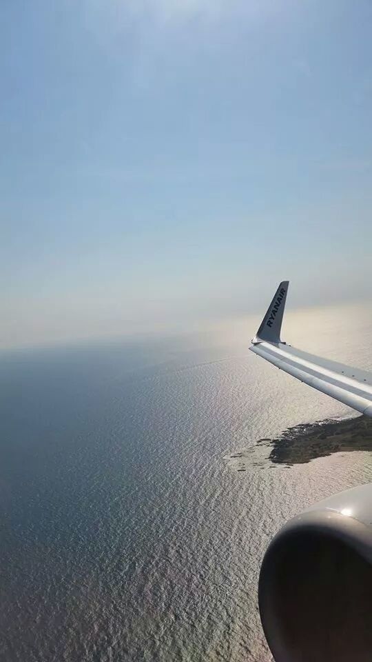 airplane, air vehicle, cropped, aircraft wing, part of, transportation, sky, sunset, scenics, flying, mode of transport, tranquil scene, cloud - sky, no people, travel, horizon over water, copy space, nature, tranquility, aerial view