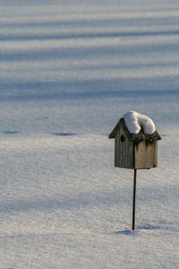 Lifeguard hut on land during winter