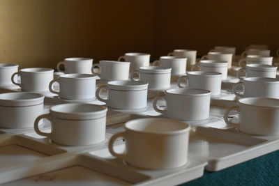 Close-up of coffee cups on table