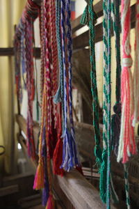 Multi colored strings hanging in factory