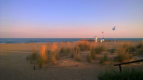 View of beach against sky during sunset