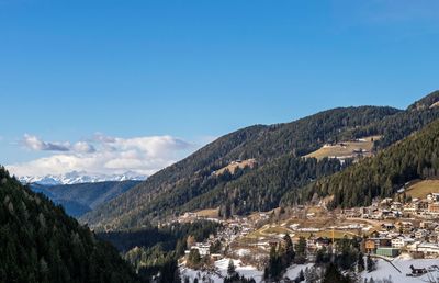 Scenic view of mountains against clear blue sky