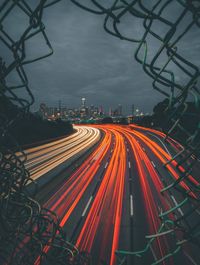 High angle view of light trails on highway at night