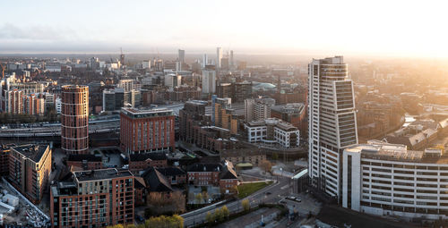 An aerial panoramic view of a leeds cityscape skyline early morning sunlight at sunrise