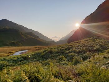 Scenic view of mountains against sky during sunset