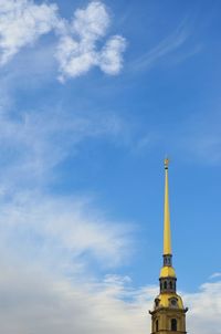 Low angle view of building against cloudy sky