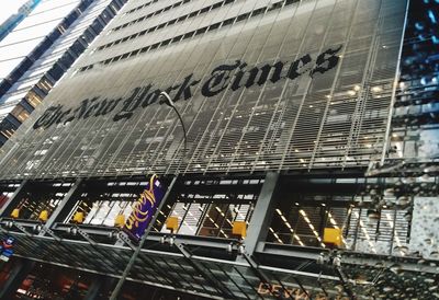 Low angle view of text on building in city