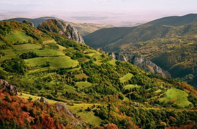 Scenic view of landscape and mountains against sky