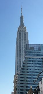 Low angle view of building against clear blue sky