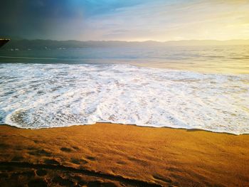 Scenic view of sea against sky at sunset