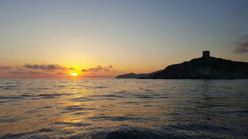 Scenic view of sea against sky during sunset