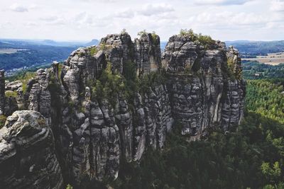 Panoramic view of rock formation on landscape against sky