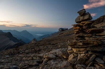 Rock formations against sky during sunset