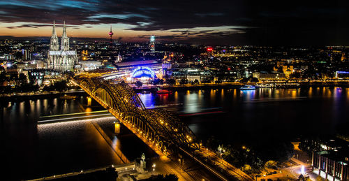 High angle view of illuminated buildings in city at night