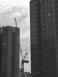 Low angle view of crane at construction site