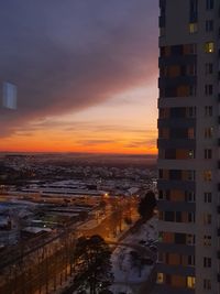 High angle view of buildings against sky at sunset
