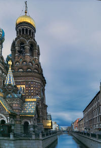 Low angle view of buildings against sky in city