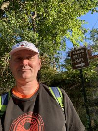 Portrait of man standing against plants