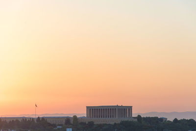 Buildings against sky during sunset