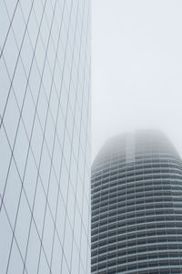 Low angle view of modern buildings against sky