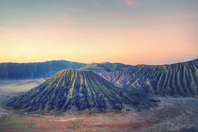 Panoramic view of volcanic landscape against sky during sunset