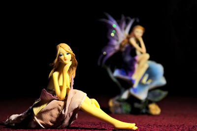 Close-up of stuffed toy against black background