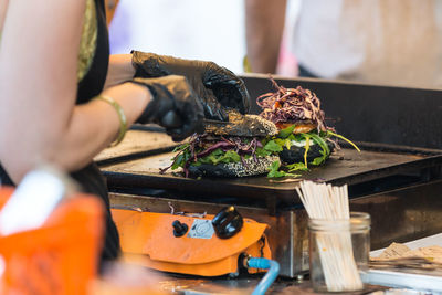 Midsection of man preparing food