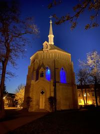 Low angle view of historic building against sky at night