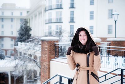 Portrait of smiling woman in snow