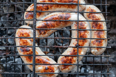 Close-up of meat on barbecue grill