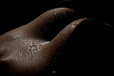 Midsection of sensuous woman with sweat