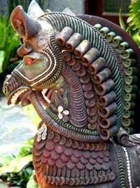 Close-up of angel statue against temple