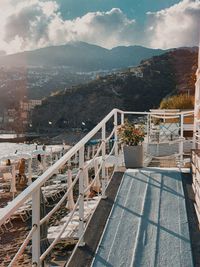 View of swimming pool by sea against sky