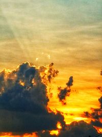 Low angle view of dramatic sky during sunset