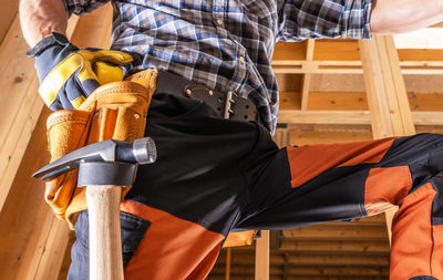 Low section of man working in workshop