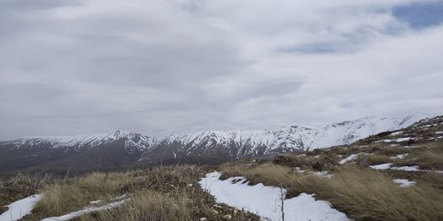 Scenic view of snowcapped mountains against sky