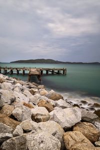 Pier over sea against sky