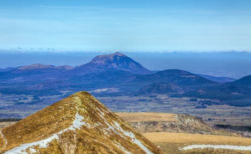 Scenic view of mountain against cloudy sky