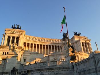 Low angle view of statues against sky