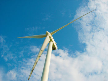 Low angle view of windmill against sky