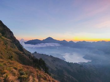 Scenic view of mountains against sky during sunset