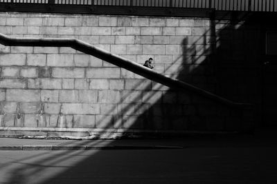 Shadow of railing on footpath