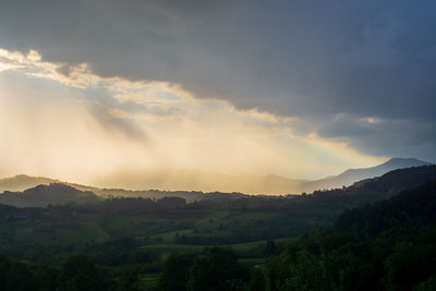 Scenic view of landscape against sky during sunset