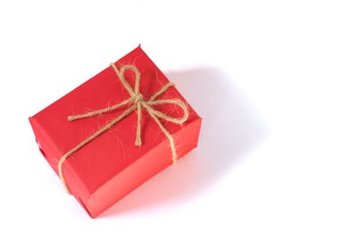 Close-up of red umbrella against white background